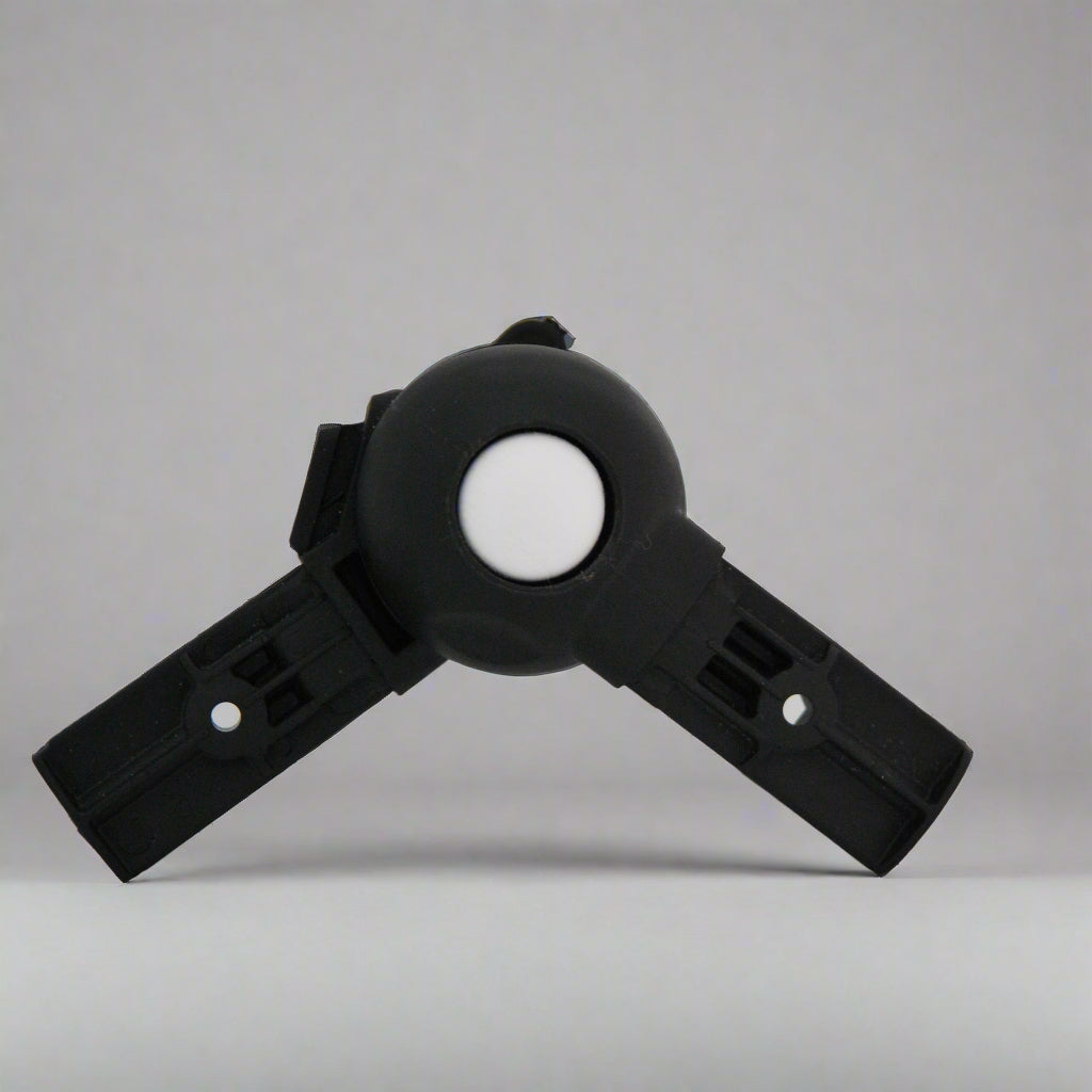 Black plastic yoyo button pushchair support with white button fitted